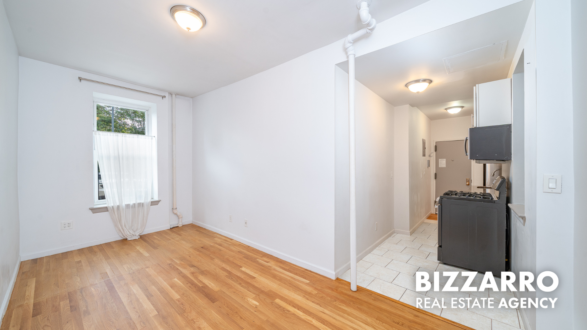 327 Edgecombe Avenue, Unit 1B Manhattan, NY 10031 - Photo 4 of 8 a view of empty room with wooden floor