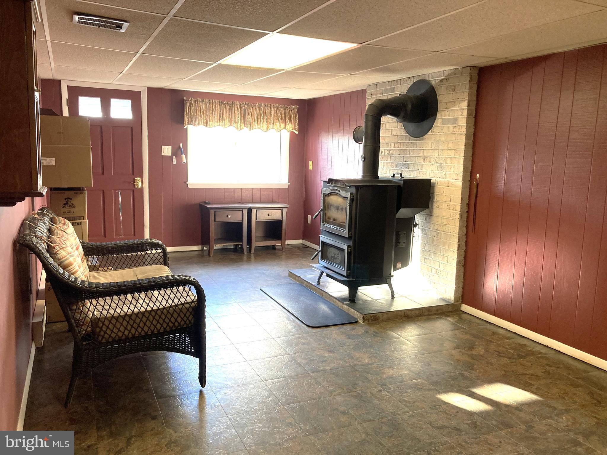 31 McElwee Road Dauphin, PA 17018 - Photo 11 of 27 Family room Coal stove