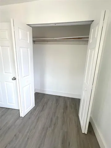 a view of front door with wooden floor
