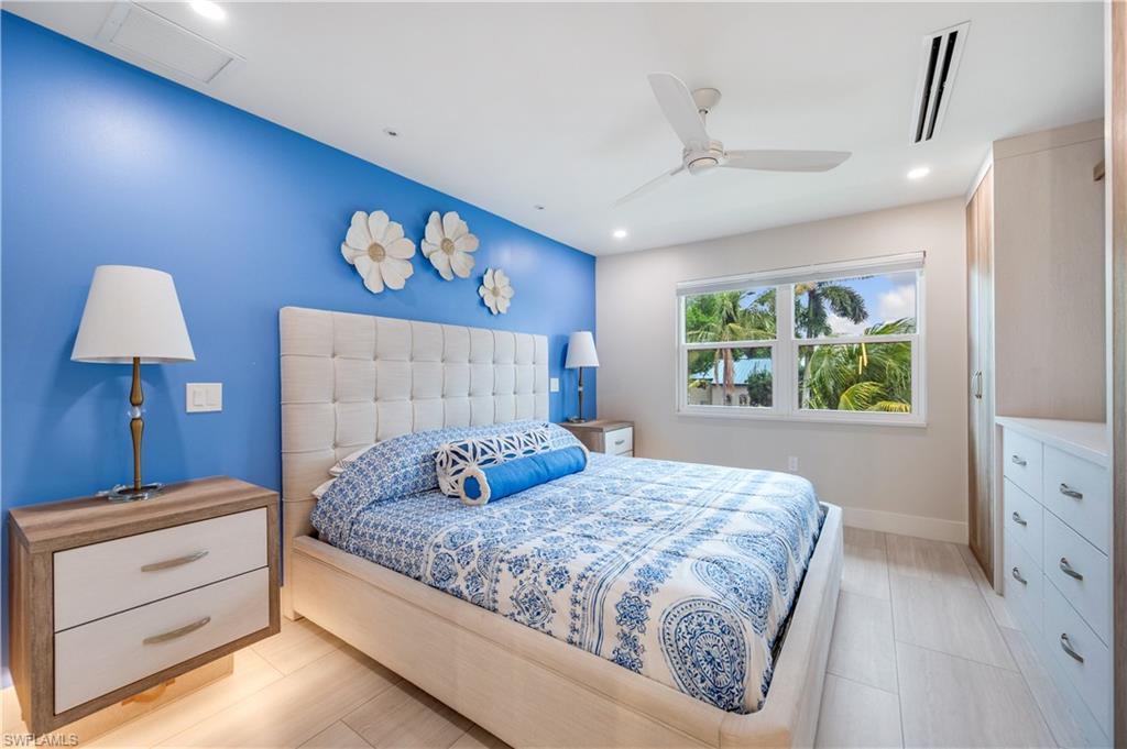 1021 3rd Street South, Unit 310 Naples, FL 34102 - Photo 12 of 20 a bedroom with a bed and a window