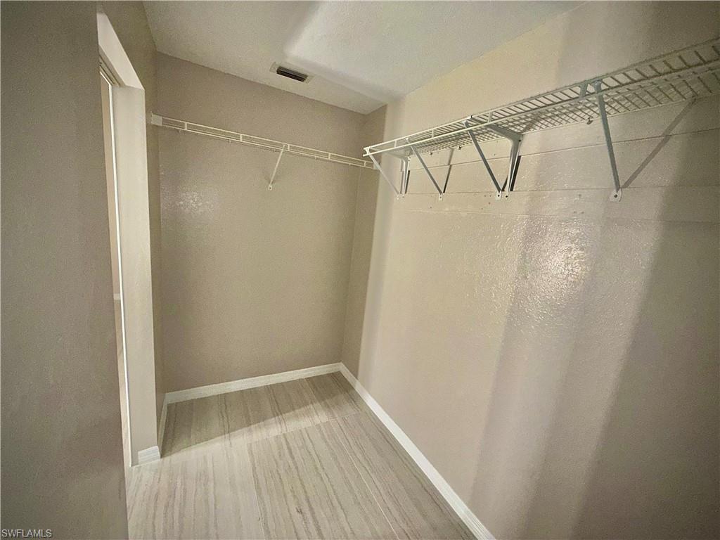 241 8th Street Southeast Naples, FL 34117 - Photo 20 of 50 a view of a room with racks on the wall