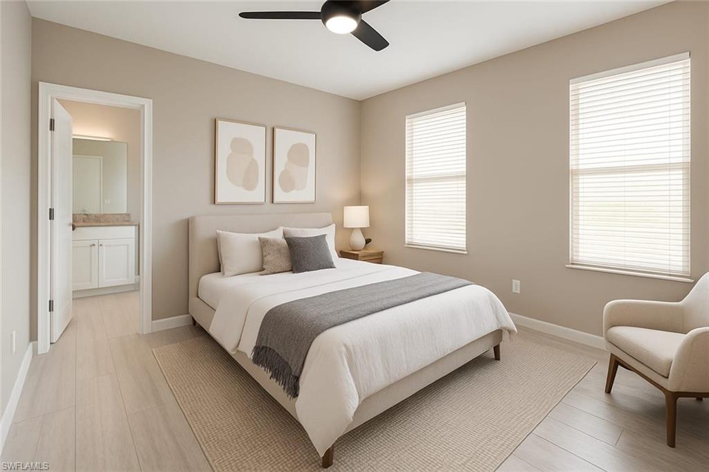 241 8th Street Southeast Naples, FL 34117 - Photo 29 of 50 a bedroom with a bed and furniture