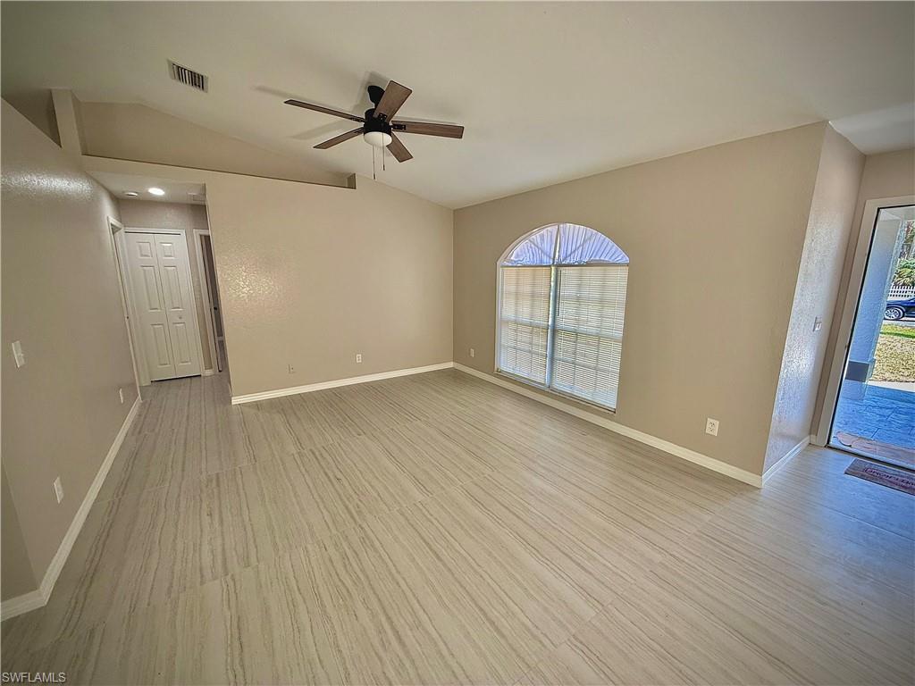 241 8th Street Southeast Naples, FL 34117 - Photo 6 of 50 wooden floor in an empty room with a window