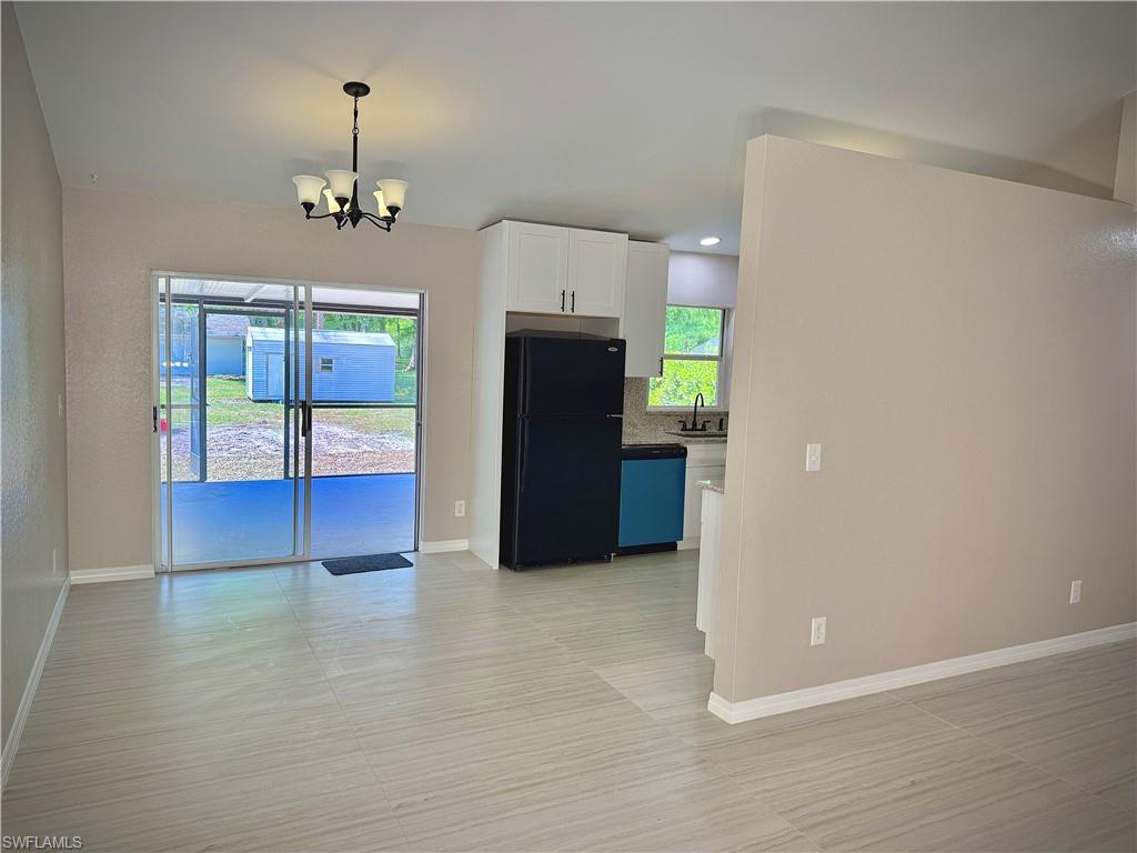 241 8th Street Southeast Naples, FL 34117 - Photo 9 of 50 a view of a livingroom with a chandelier