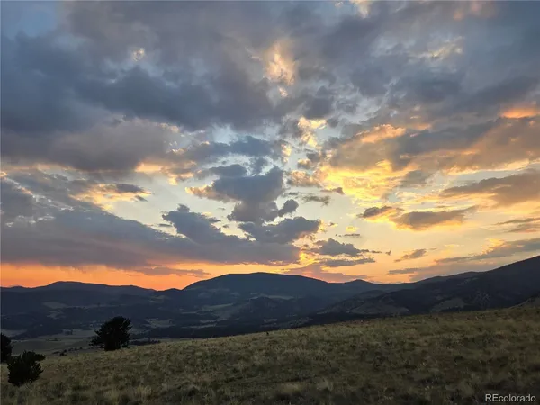 a view of house and mountains