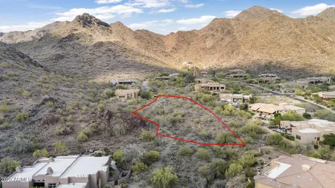 an aerial view of a houses with a yard