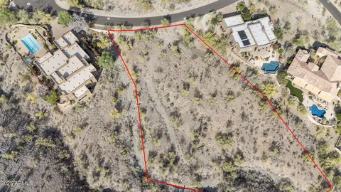 view of a dry yard with wooden floor and fence