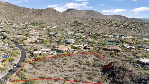 a view of a city with mountains in the background