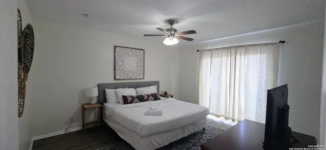 a bedroom with a bed and a window