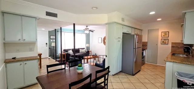 a view of a kitchen and dining room