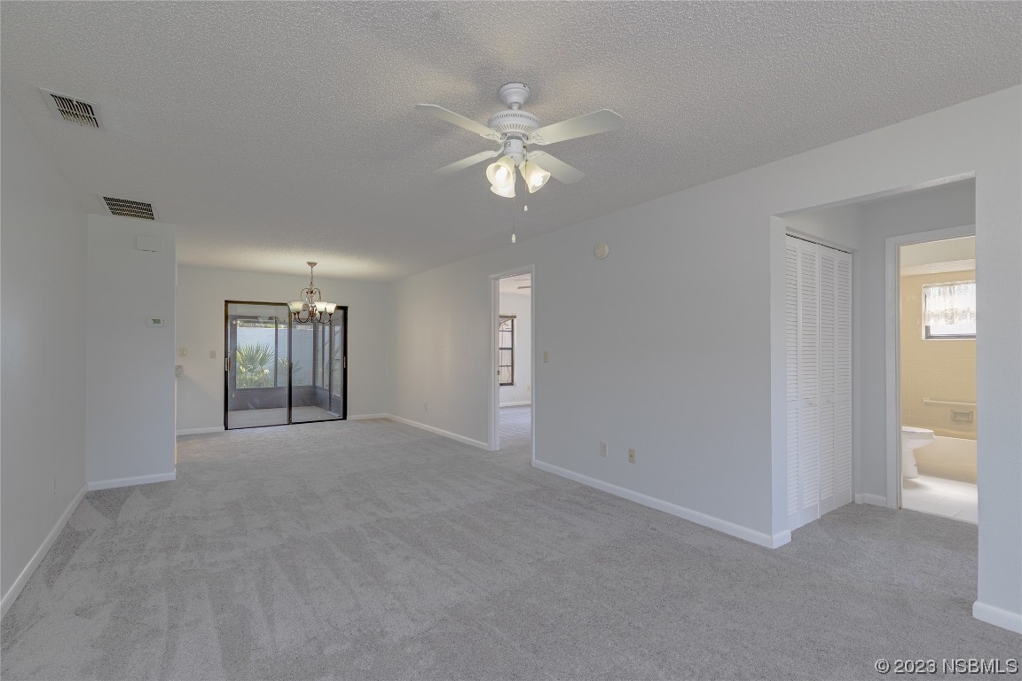 404 Sea Gull Court Edgewater, FL 32141 - Photo 12 of 28 a view of an empty room with a ceiling fan