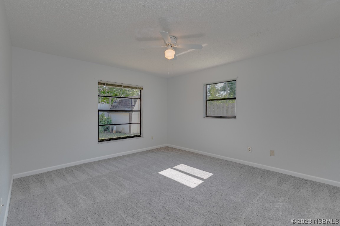 404 Sea Gull Court Edgewater, FL 32141 - Photo 14 of 28 an empty room with a window
