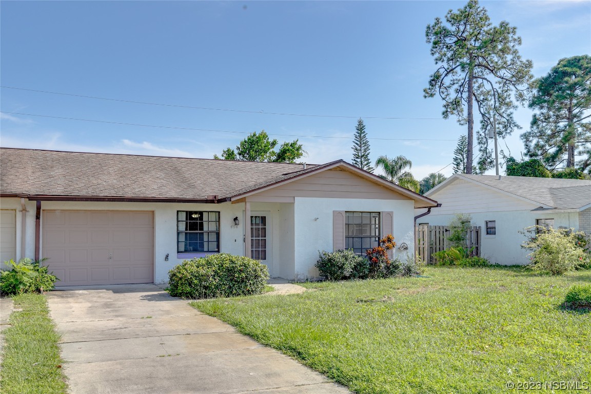 404 Sea Gull Court Edgewater, FL 32141 - Photo 2 of 28 front view of house with a yard