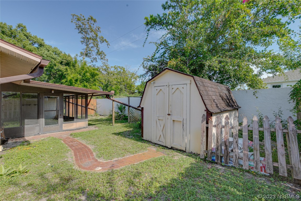 404 Sea Gull Court Edgewater, FL 32141 - Photo 26 of 28 a view of backyard with green space