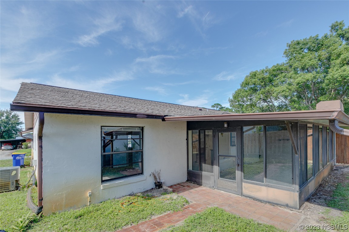 404 Sea Gull Court Edgewater, FL 32141 - Photo 27 of 28 a front view of a house with garden
