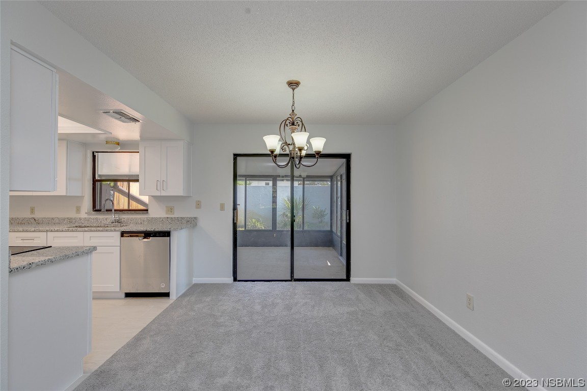 404 Sea Gull Court Edgewater, FL 32141 - Photo 5 of 28 a view of a kitchen with a sink and dishwasher a kitchen view