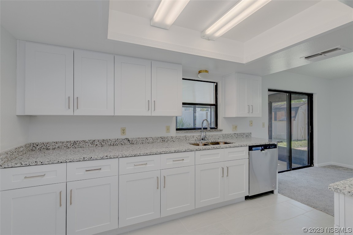 404 Sea Gull Court Edgewater, FL 32141 - Photo 8 of 28 a kitchen with a sink and cabinets