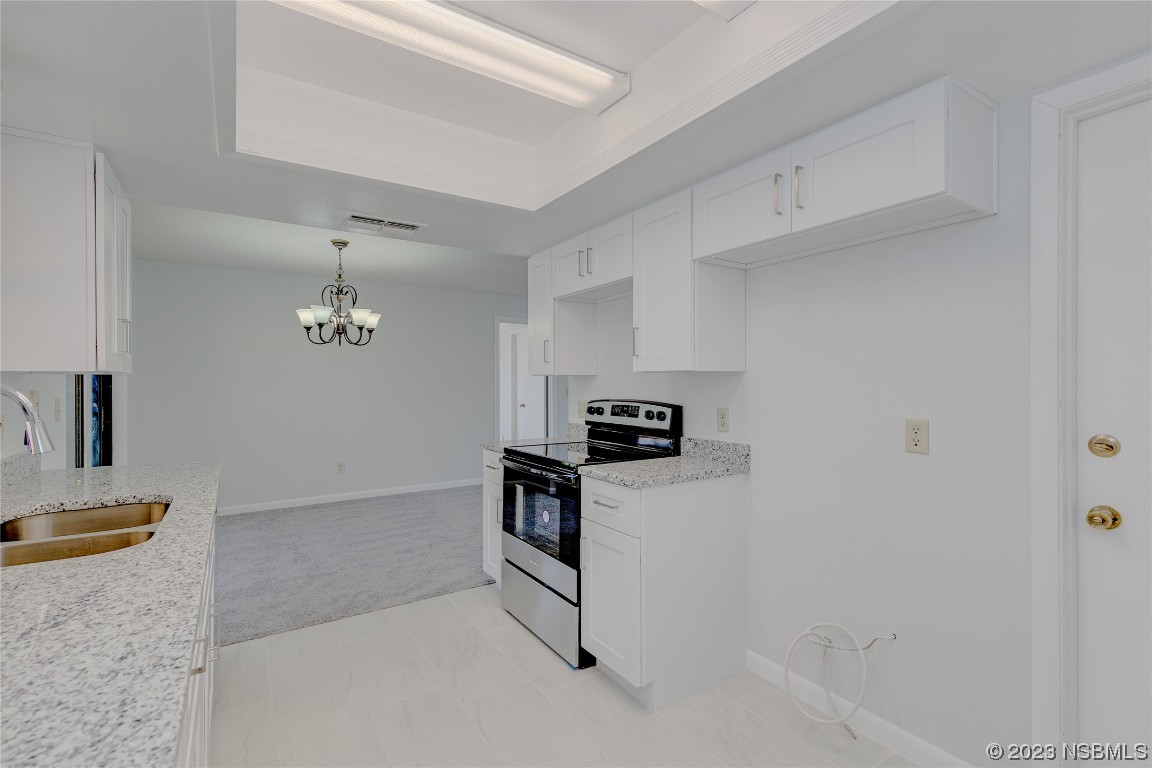 404 Sea Gull Court Edgewater, FL 32141 - Photo 9 of 28 a view of kitchen with cabinets