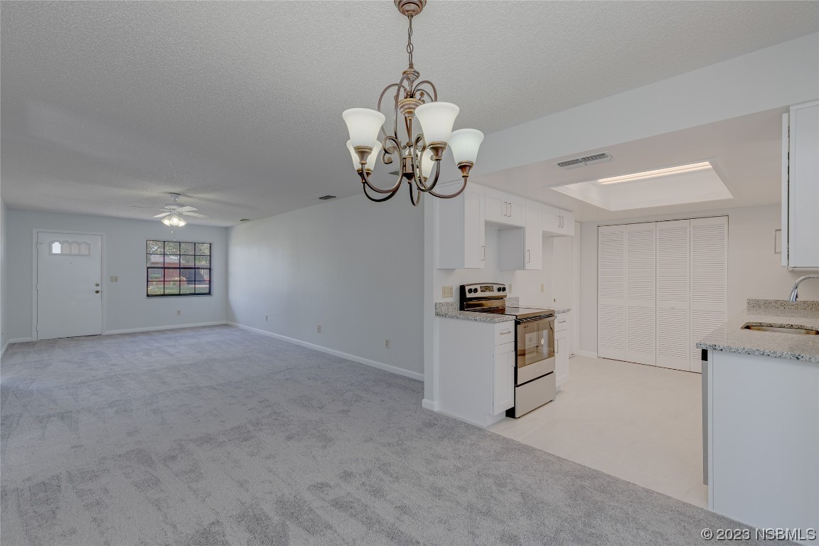 404 Sea Gull Court Edgewater, FL 32141 - Photo 10 of 28 a view of a kitchen with microwave and cabinets