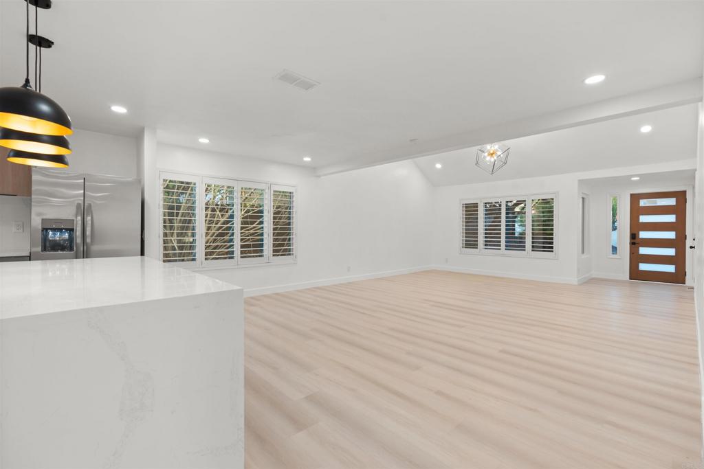 1708 Harold Road Escondido, CA 92026 - Photo 11 of 40 a view of empty room with wooden floor and windows