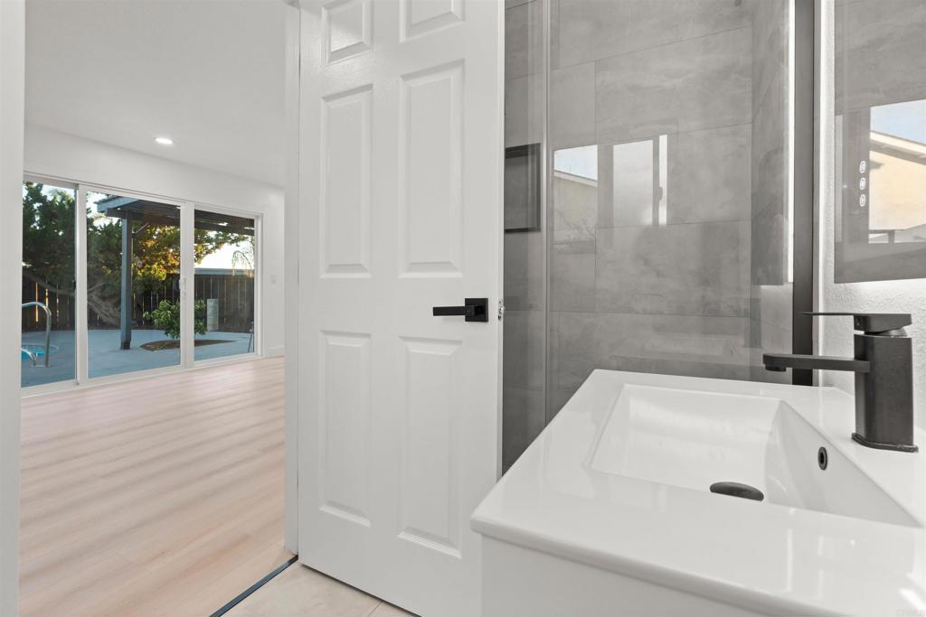 1708 Harold Road Escondido, CA 92026 - Photo 15 of 40 a bathroom with a sink and a bathtub