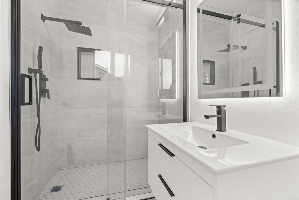 1708 Harold Road Escondido, CA 92026 - Photo 17 of 40 a bathroom with a sink shower and a mirror