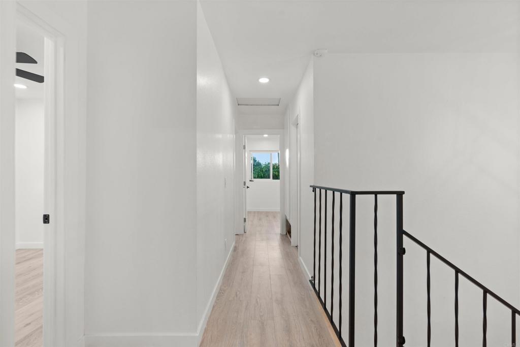 1708 Harold Road Escondido, CA 92026 - Photo 20 of 40 a view of a hallway with wooden floor