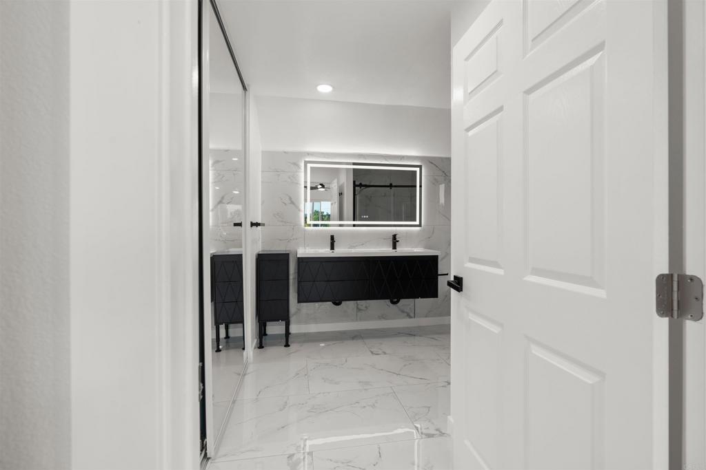 1708 Harold Road Escondido, CA 92026 - Photo 29 of 40 a bathroom with a sink and mirror