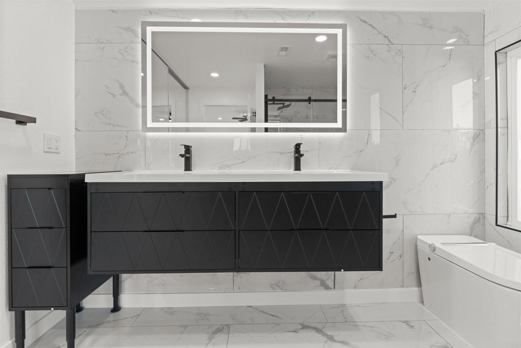 1708 Harold Road Escondido, CA 92026 - Photo 30 of 40 a bathroom with a sink and a mirror