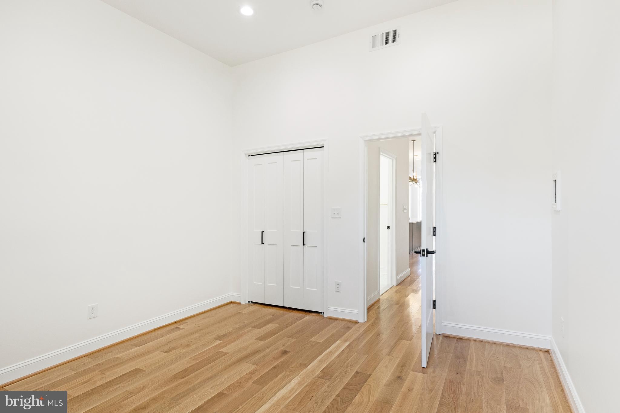 1102 Harlem Avenue Baltimore, MD 21217 - Photo 11 of 36 a view of room with wooden floor