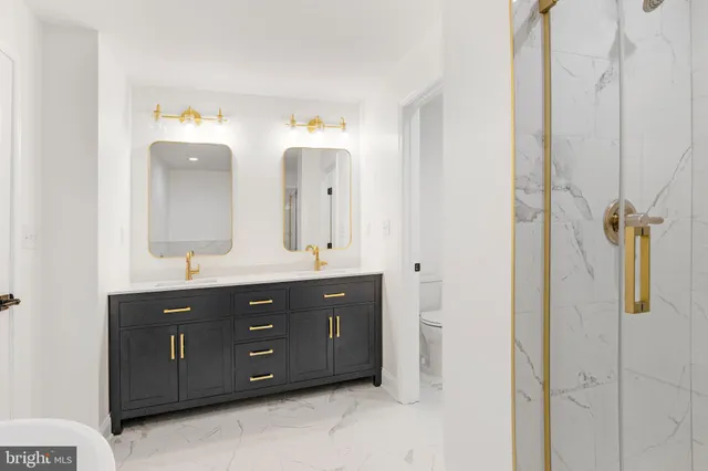 a bathroom with a double vanity sink and mirror