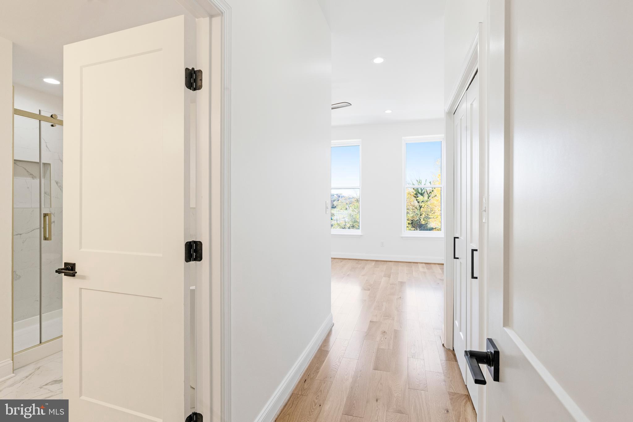 1102 Harlem Avenue Baltimore, MD 21217 - Photo 23 of 36 a view of a hallway with wooden floor and closet area