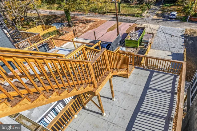 a view of entryway with wooden stairs