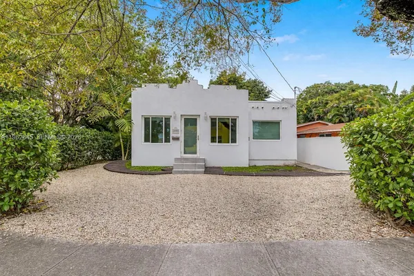 front view of a house with a yard