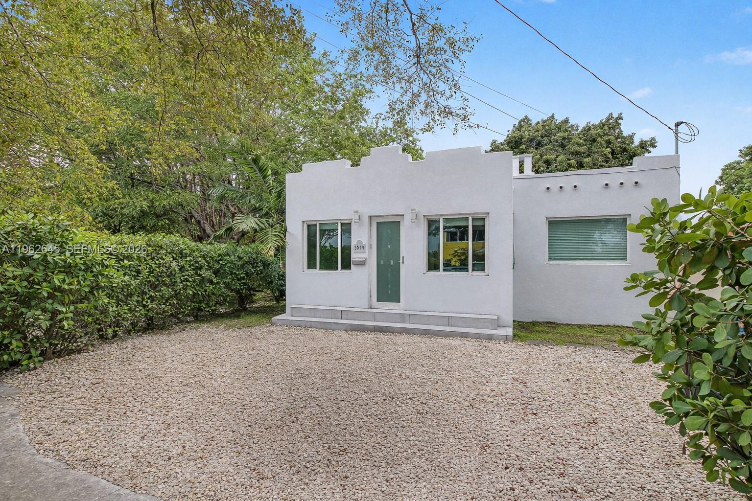 2900 Southwest 4th Street Miami, FL 33135 - Photo 2 of 18 front view of a house with a tree