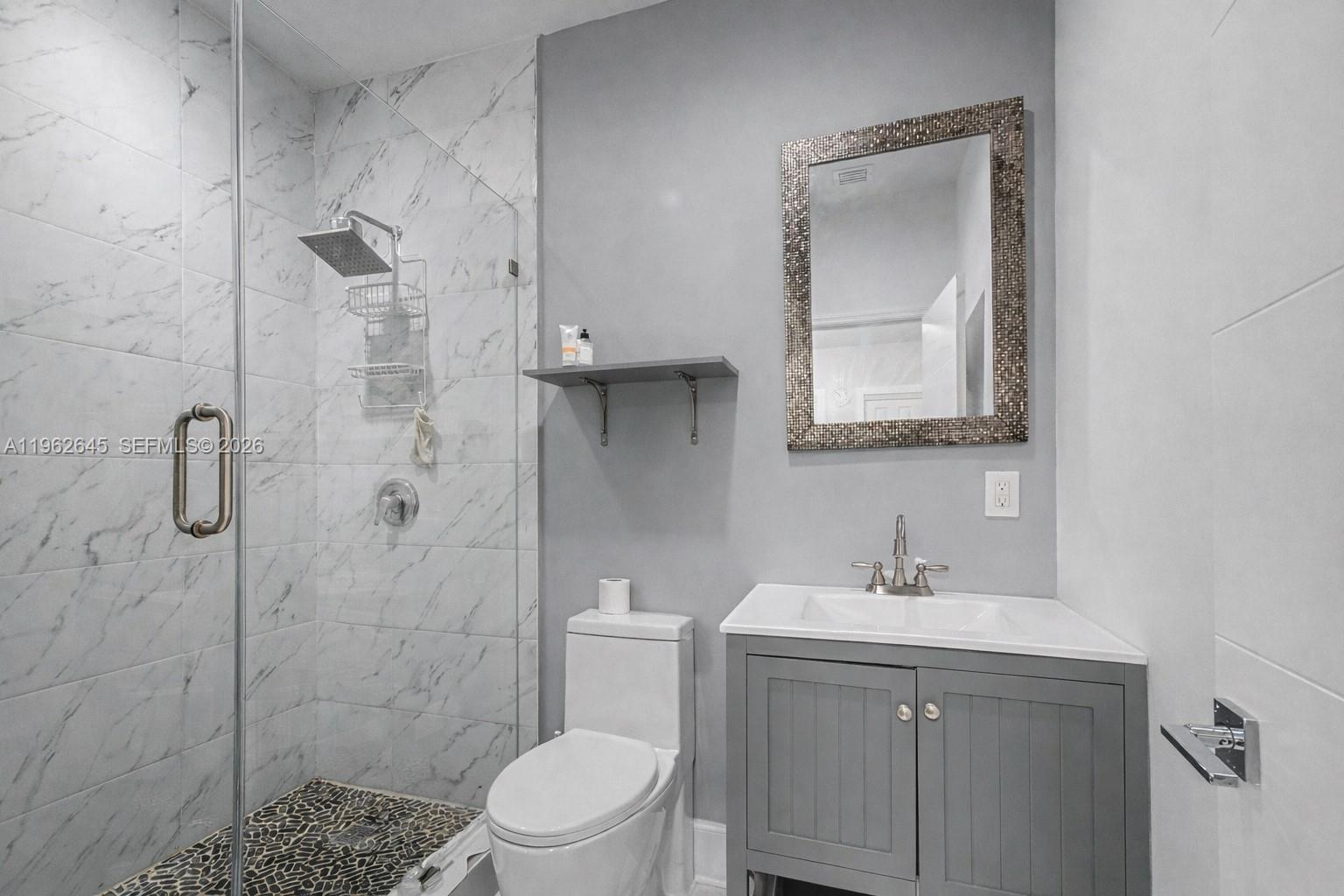 2900 Southwest 4th Street Miami, FL 33135 - Photo 10 of 18 a bathroom with a sink a toilet and shower