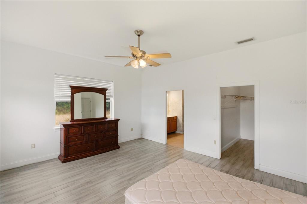1841 State Rte 66 Zolfo Springs, FL 33890 - Photo 14 of 34 a view of a livingroom with wooden floor and cabinet