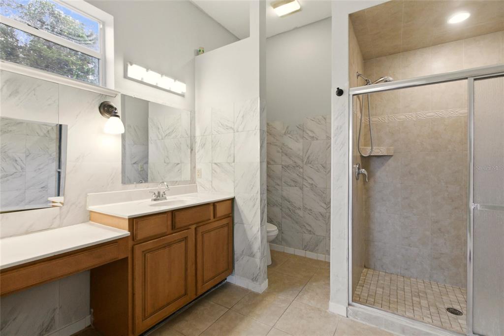 1841 State Rte 66 Zolfo Springs, FL 33890 - Photo 16 of 34 a bathroom with a double vanity sink mirror and shower