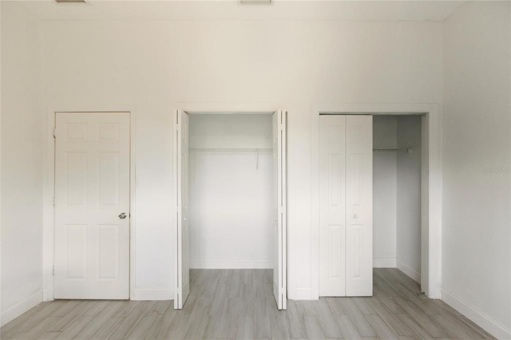 1841 State Rte 66 Zolfo Springs, FL 33890 - Photo 20 of 34 an empty room with wooden floor & closet area
