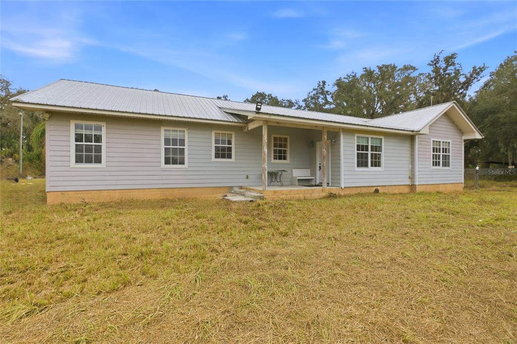 1841 State Rte 66 Zolfo Springs, FL 33890 - Photo 2 of 34 a front view of a house with yard