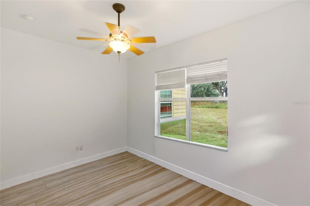 1841 State Rte 66 Zolfo Springs, FL 33890 - Photo 23 of 34 a view of a room with wooden floor fan and a window