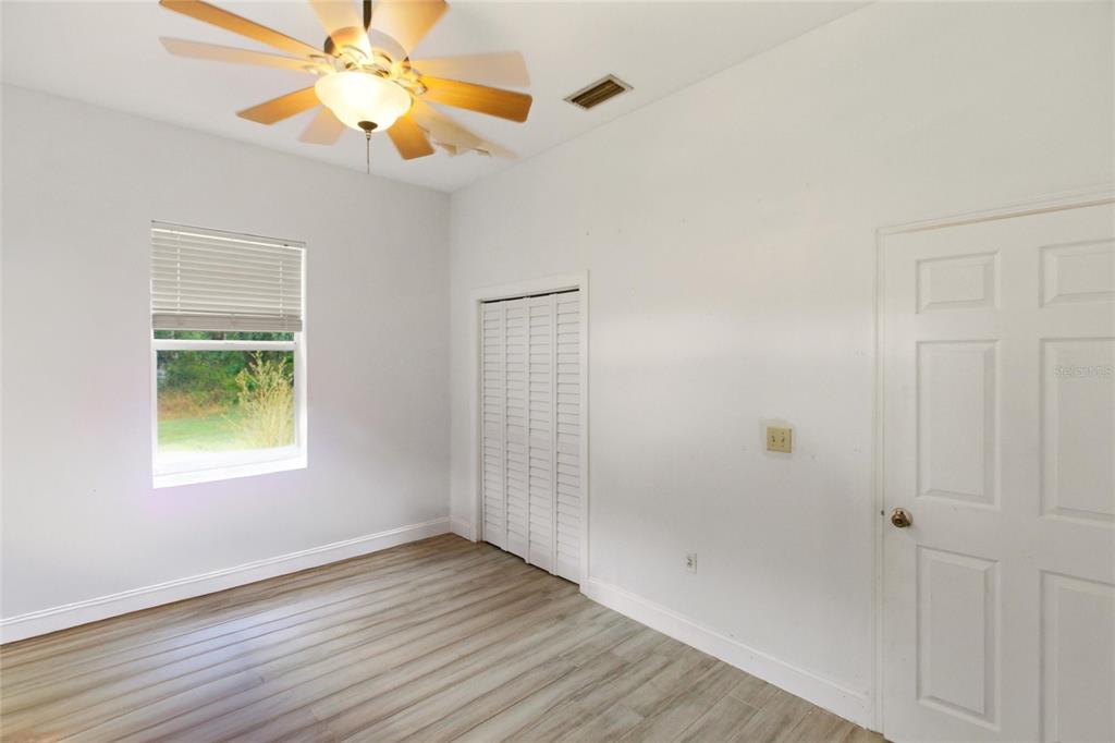 1841 State Rte 66 Zolfo Springs, FL 33890 - Photo 24 of 34 a view of an empty room with window and wooden floor