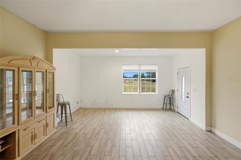 1841 State Rte 66 Zolfo Springs, FL 33890 - Photo 4 of 34 a view of empty room with wooden floor and fan