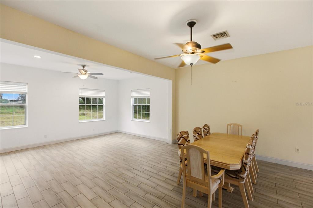 1841 State Rte 66 Zolfo Springs, FL 33890 - Photo 6 of 34 a view of a dining room with furniture and a chandelier fan