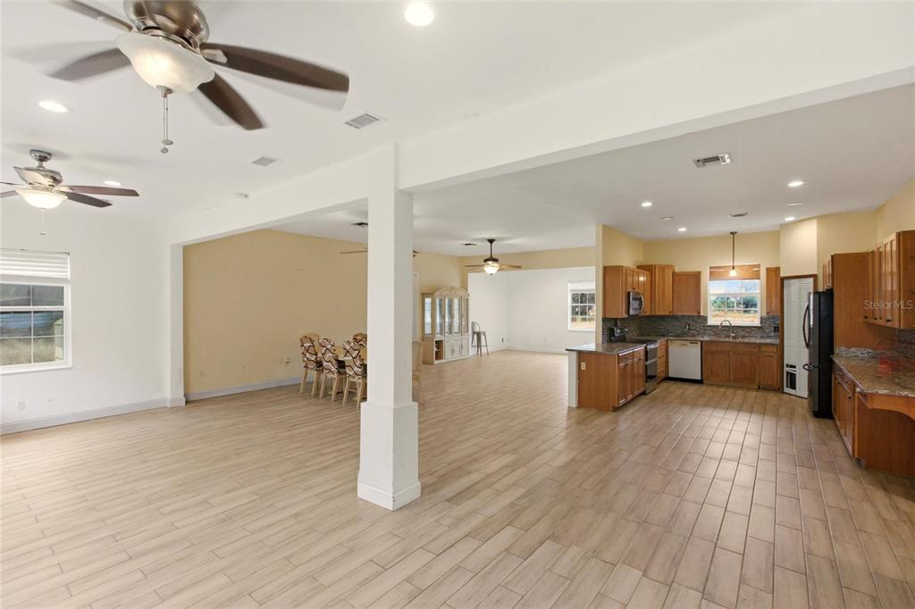 1841 State Rte 66 Zolfo Springs, FL 33890 - Photo 8 of 34 a view of a living room kitchen with furniture and wooden floor