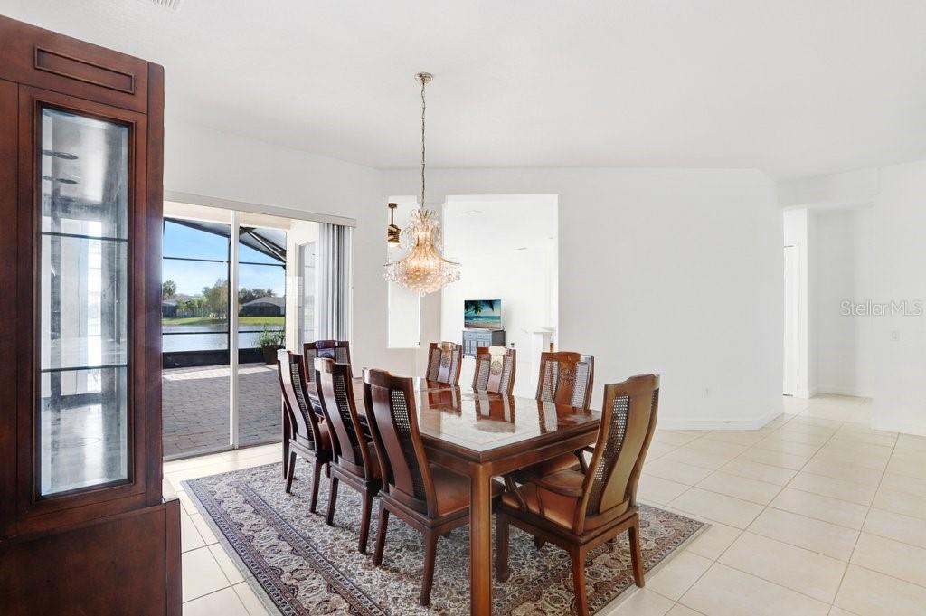 699 Glendora Road Kissimmee, FL 34759 - Photo 34 of 56 a view of a dining room with furniture window and wooden floor