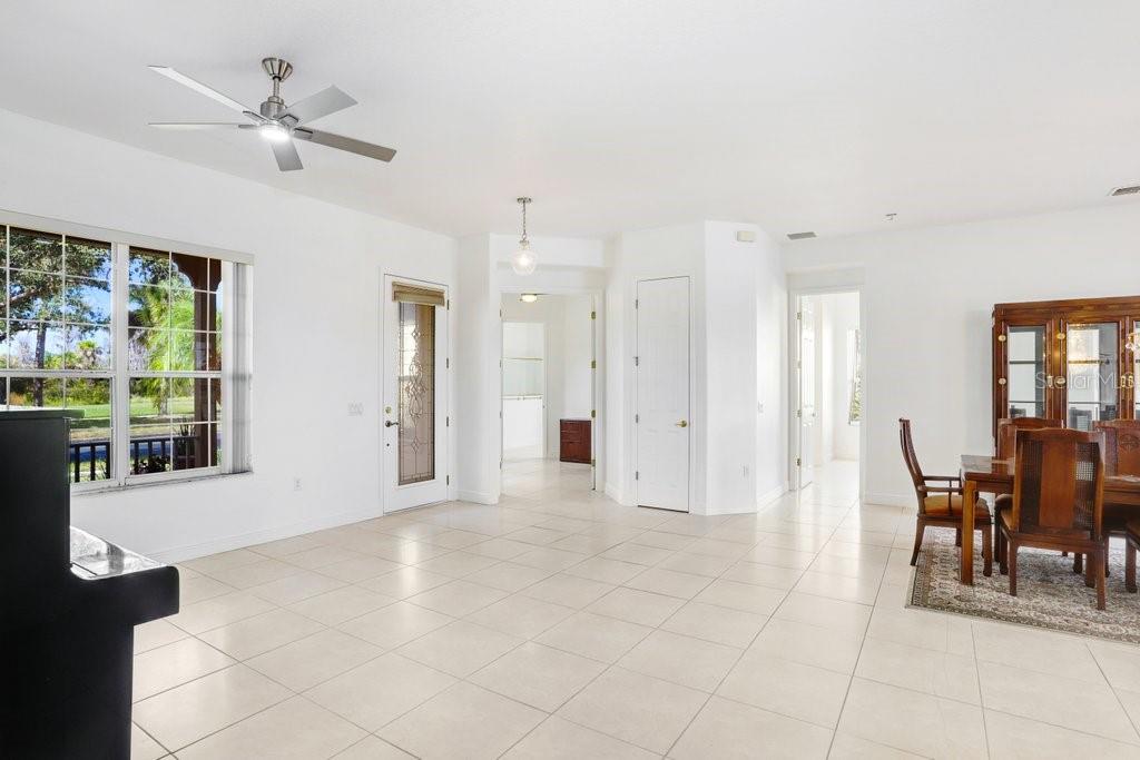 699 Glendora Road Kissimmee, FL 34759 - Photo 36 of 56 a view of a livingroom with furniture and a ceiling fan