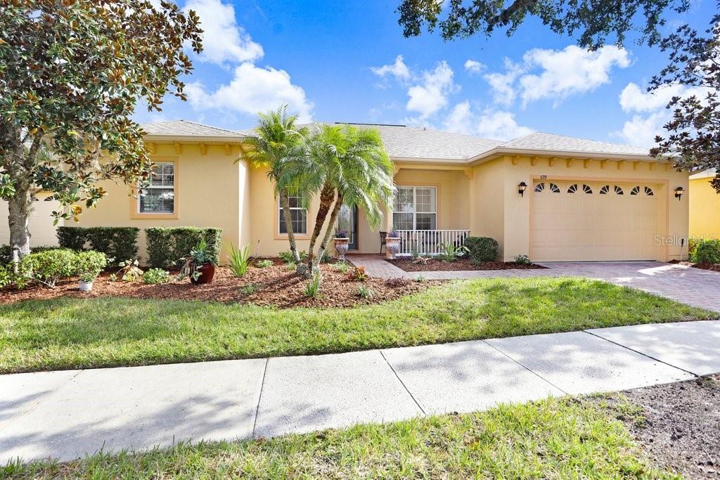 699 Glendora Road Kissimmee, FL 34759 - Photo 38 of 56 a front view of a house with garden