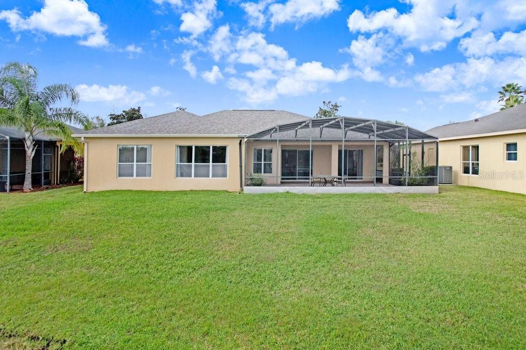699 Glendora Road Kissimmee, FL 34759 - Photo 42 of 56 a front view of a house with a garden