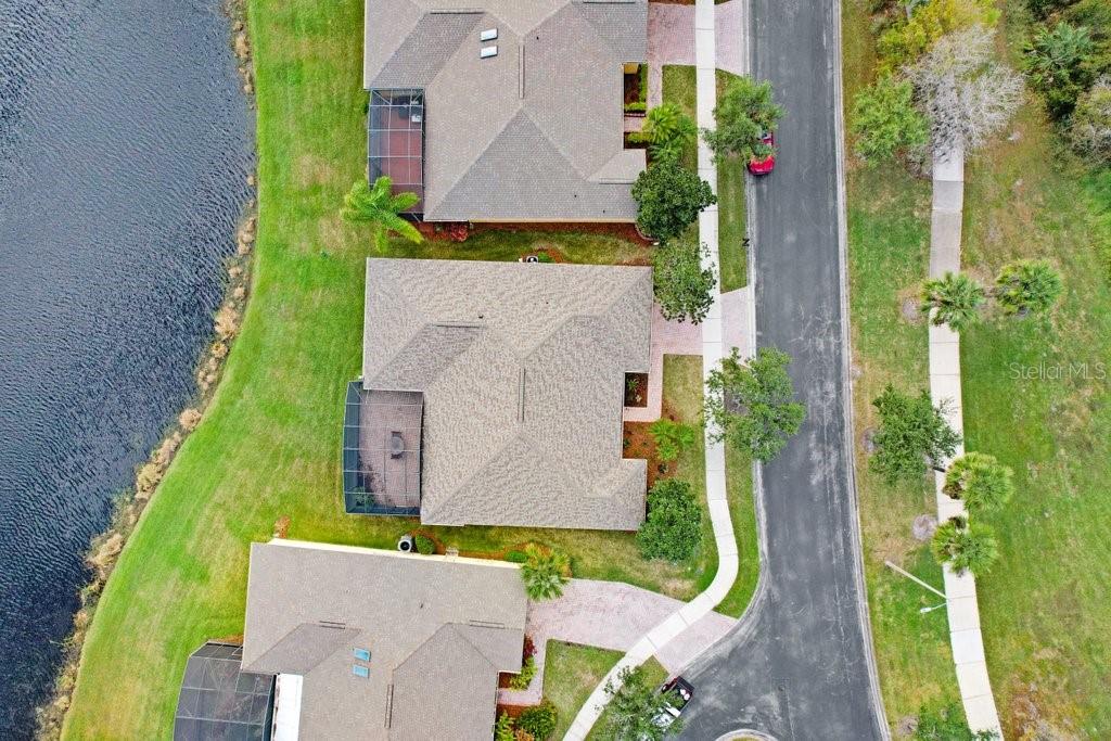 699 Glendora Road Kissimmee, FL 34759 - Photo 43 of 56 an aerial view of a house with a yard and a fountain